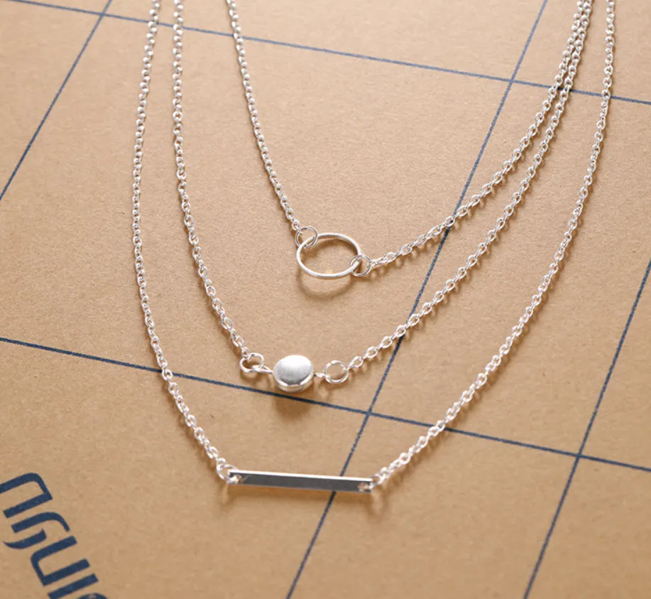 Aperture metal rod necklace