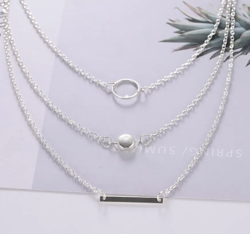 Aperture metal rod necklace