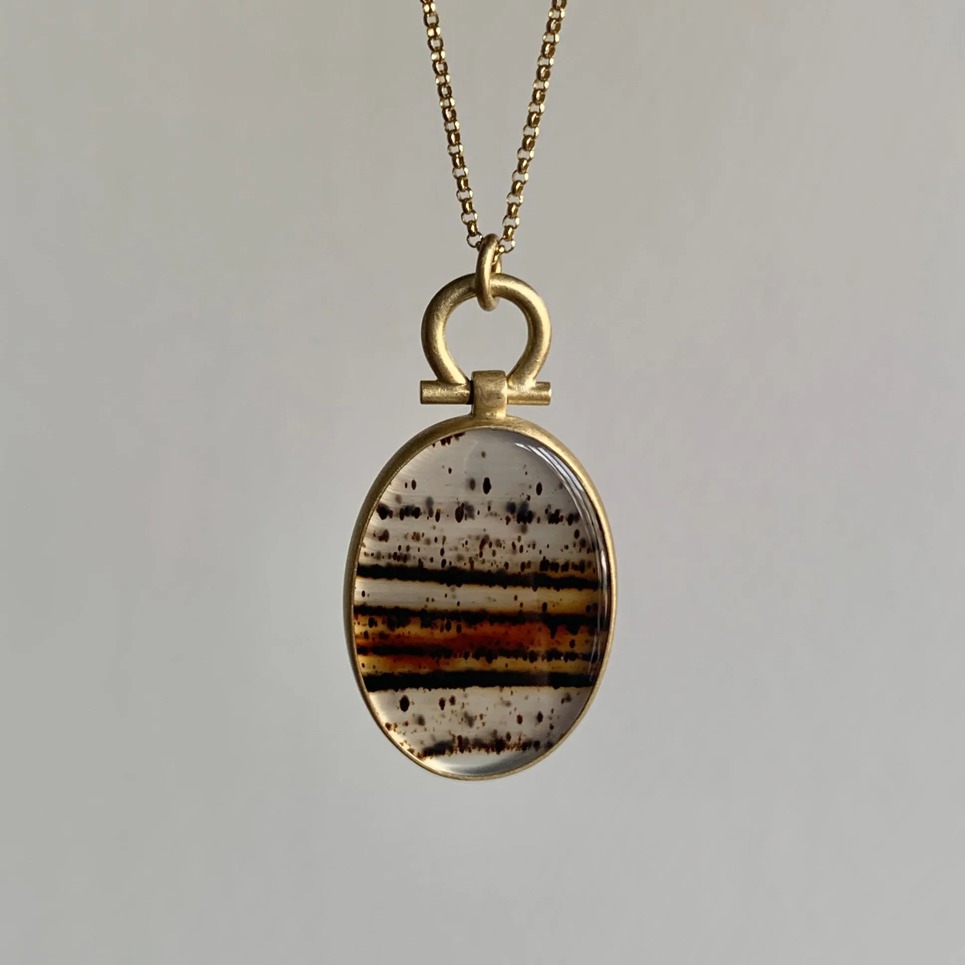 Flat Oval Montana Agate Pendant